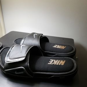 Black and sliver Nike slides